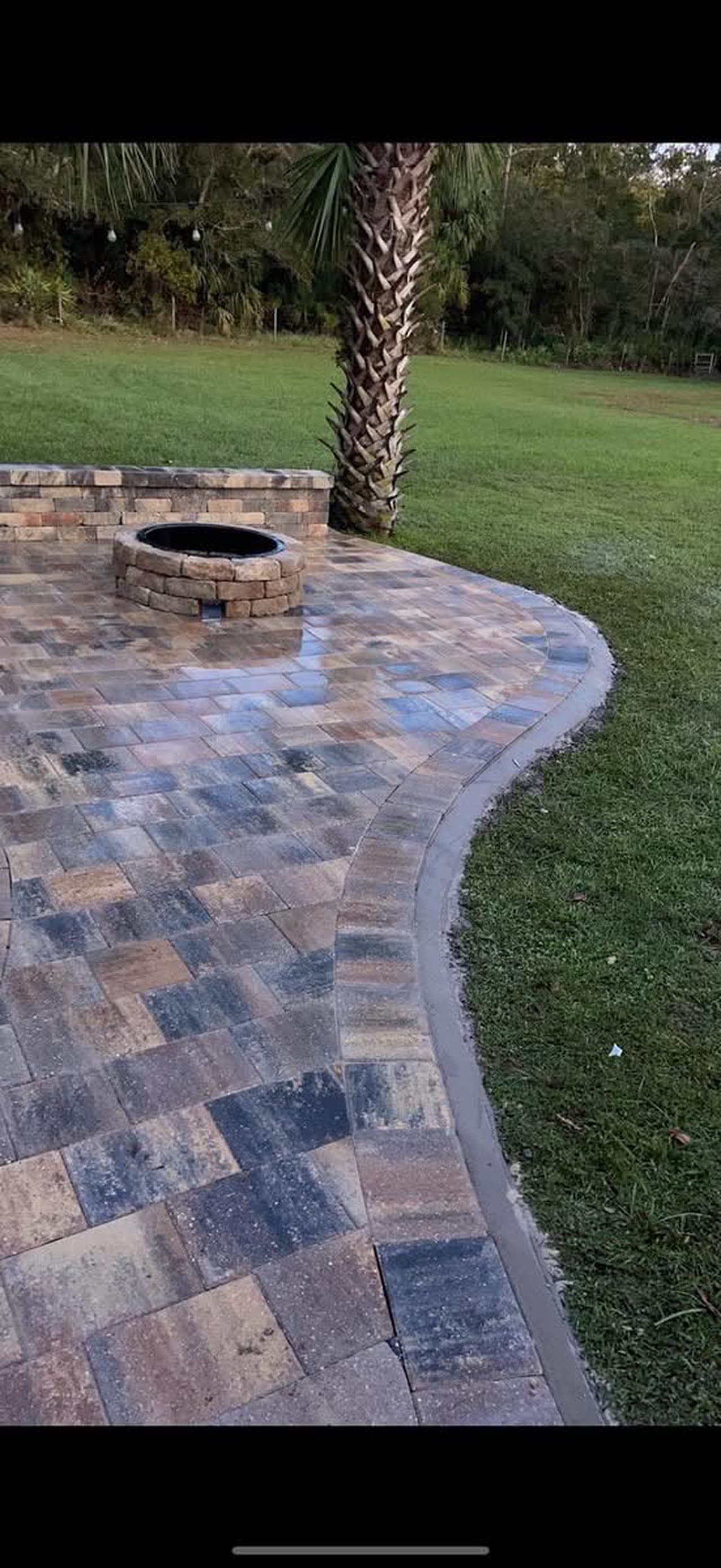 Round brick fire pit with paver patio Orlando