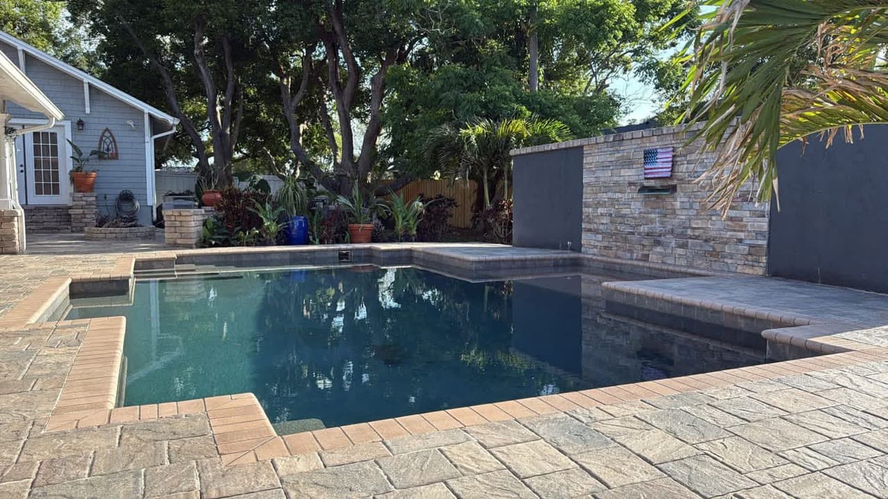Close-up of travertine pool coping edge installation